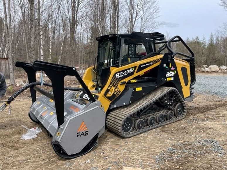 Skid steer with forestry mulcher attachment