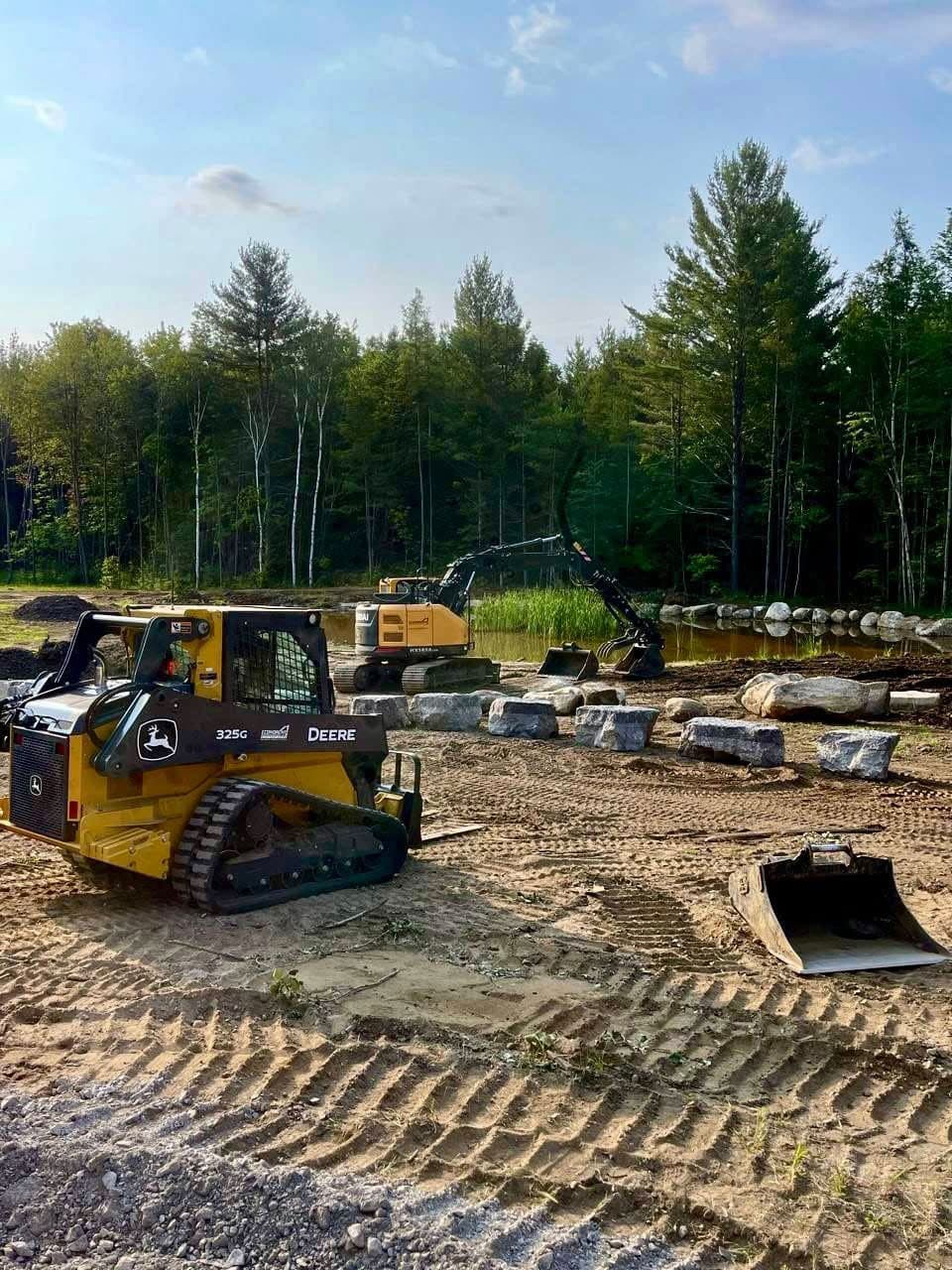 Skid steer with operator at work